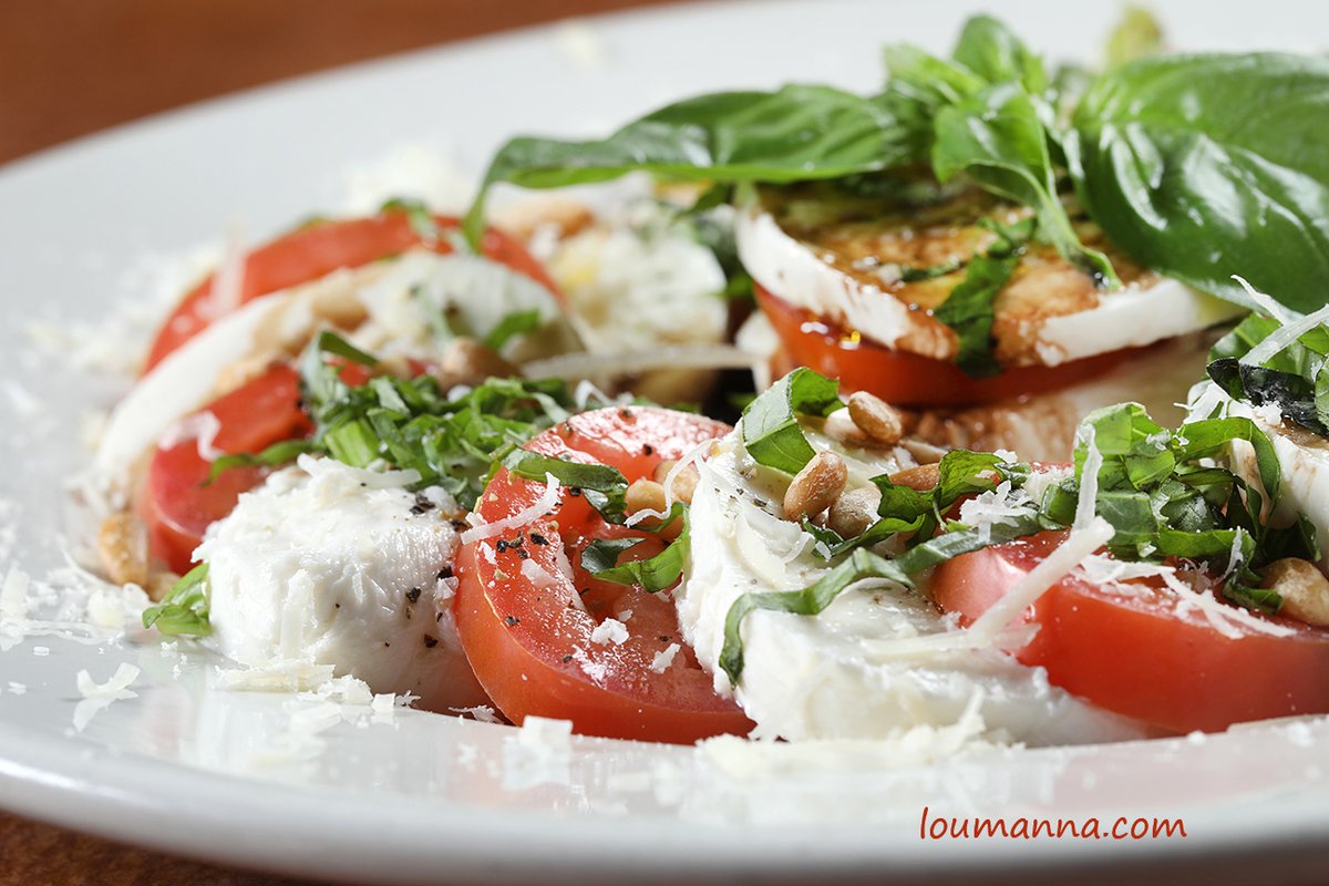 This "Tasty Tuesday" is screaming for you to have a Caprese Salad!!!
Especially this one that I photographed at Zozo's Ristorante in Reno, NV!
Caprese Salad is a simple Italian salad, made of sliced fresh mozzarella, tomatoes, and sweet basil, seasoned with salt and olive oil. 😍