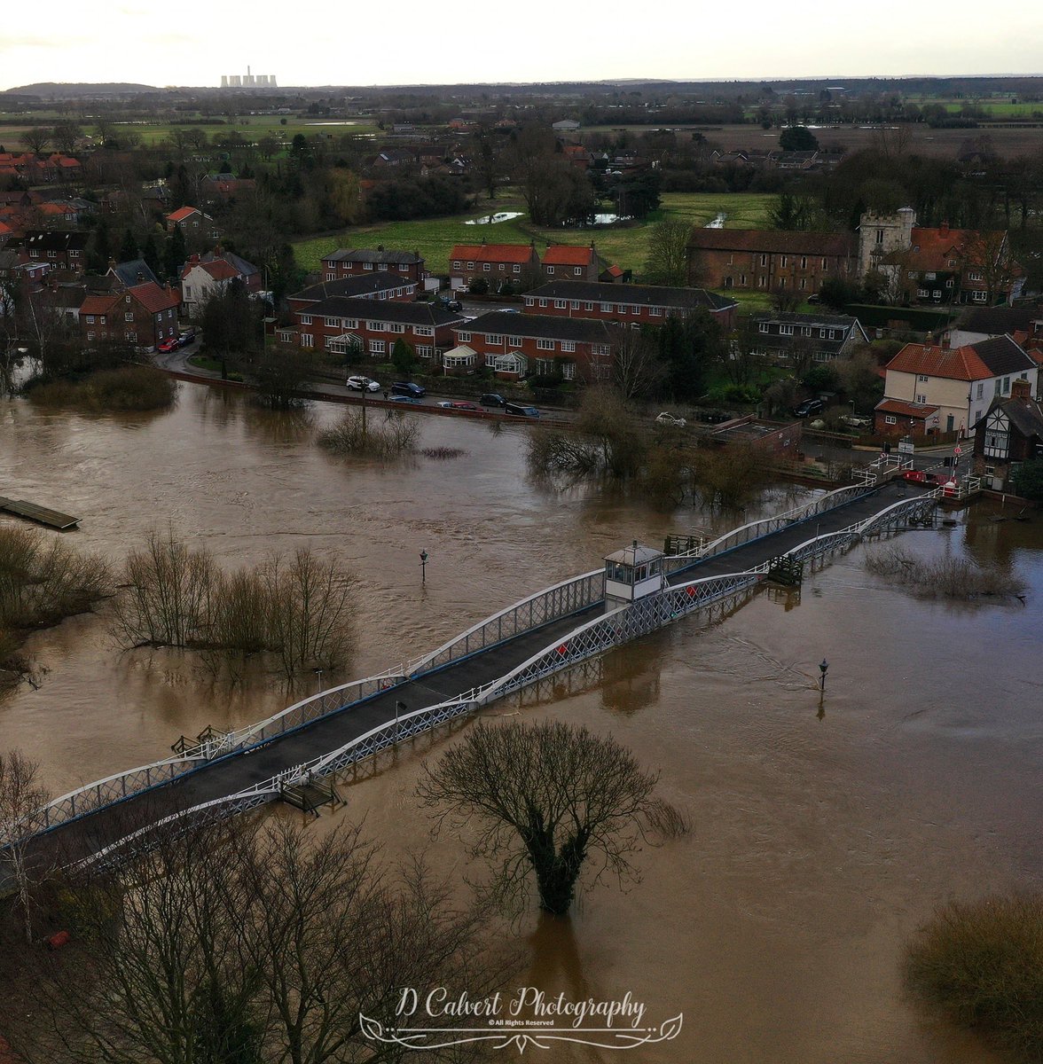 sierra18NY's tweet photo. These are images taken today of the village of #Cawood near #Selby. So far the flood defences are holding at the village side of the Ouse.🤞the water will subside soon. Images courtesy of Dave Calvert #StormDennisUK #Yorkisopen https://t.co/V4eWrlSlqu