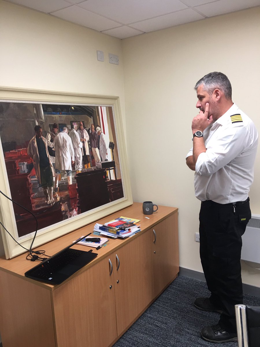 Fabulous to see Newlyn in #ThisFishingLife with @NPHC_1906 Rob- here in the boardroom with my painting of the market.