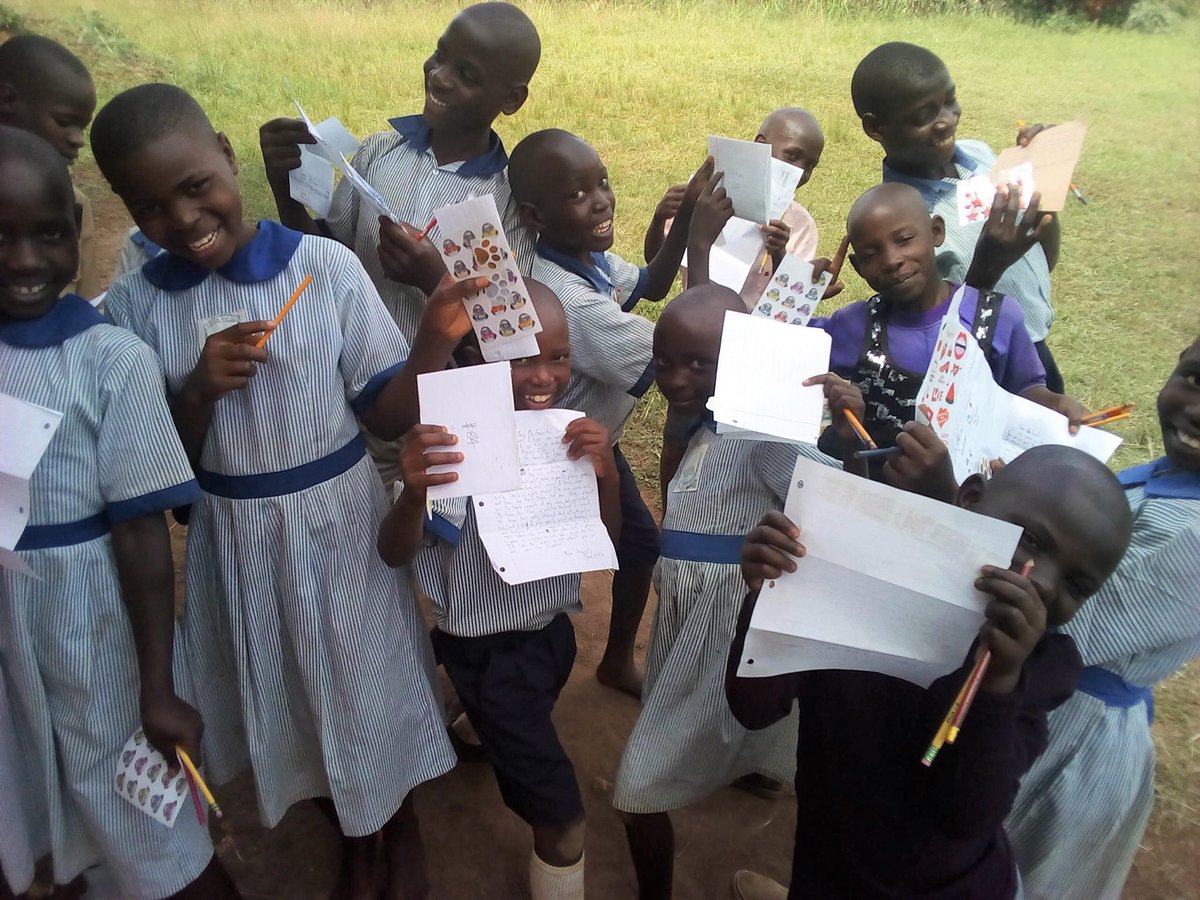CathSchoolsDOB's tweet photo. Pen pals is still a thing!! Here are a group of pen pals in Uganda reading letters from St. Thomas Aquinas School, Fairfield, students! @Diobpt @BptSup #penpal #forminghearts #informingminds #transforminglives https://t.co/C3L51CNiXC