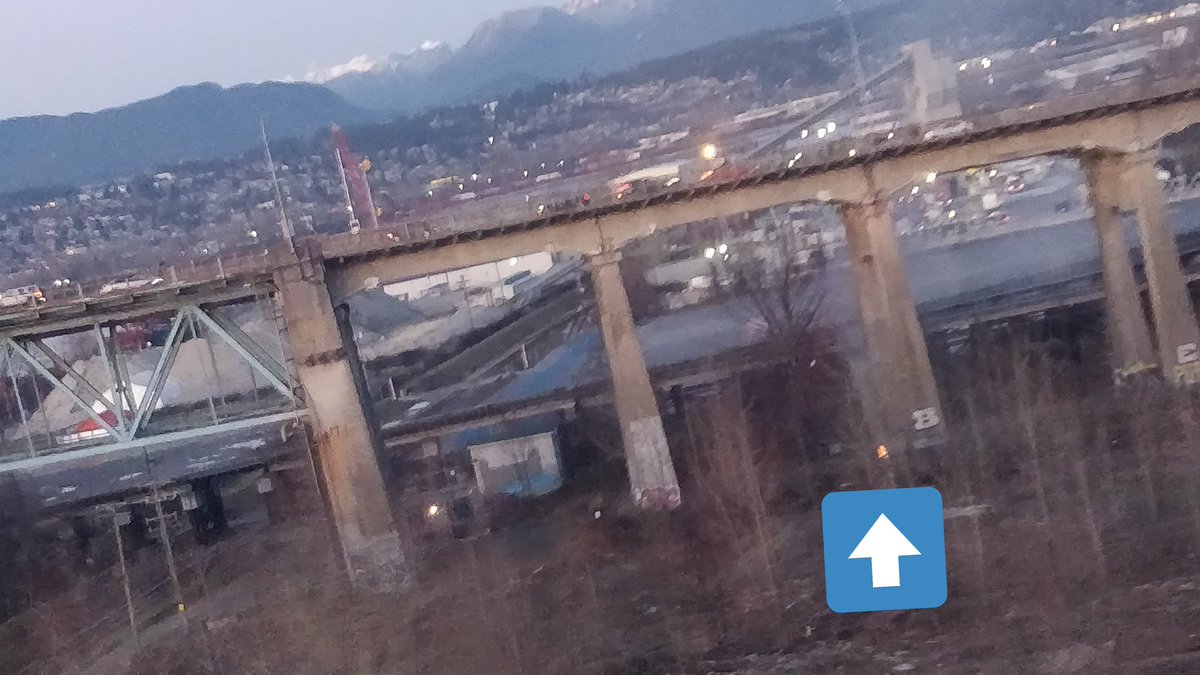 DarienImai's tweet photo. @TransLink saw this from the skytrain, seems to be a small fire under the Pattullo Bridge? Couldn't get a good picture but smoke was rising past the bridge deck https://t.co/6LBtCveiLc