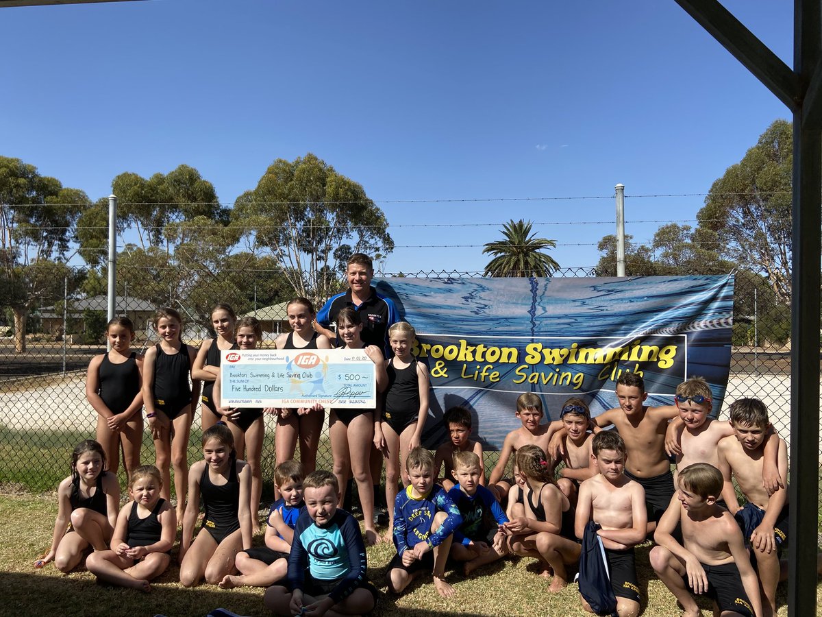 Brookton swim club showing off the new bathers and a great sponsor from Brookton IGA