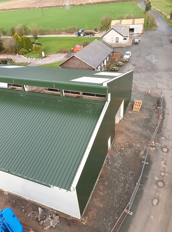 PMSFabrications's tweet photo. Progress on site at @westlandscpark where the roof and wall cladding installation shows the new visitors centre taking shape. Cracking on through the wind and rain ☔️💨😃 https://t.co/4N5Y8ax2FI