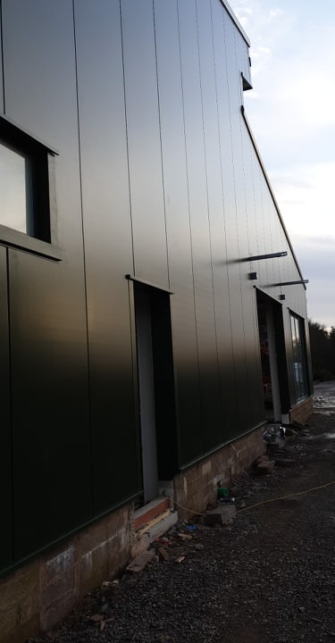 PMSFabrications's tweet photo. Progress on site at @westlandscpark where the roof and wall cladding installation shows the new visitors centre taking shape. Cracking on through the wind and rain ☔️💨😃 https://t.co/4N5Y8ax2FI