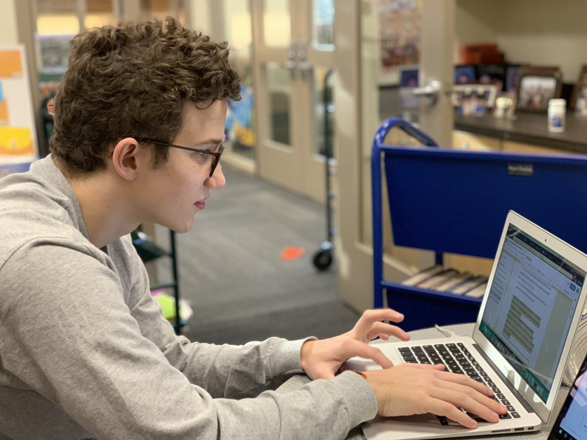 JHSCLARC's tweet photo. Ryan hard at work on his #juniorpaper citations in the library office. He got help finding articles this weekend at the @portlandstate library, a great idea!!  If you need assistance with sources or citations, come and see us. We can help! #MLA8 #citationangst @JesuitHighPDX https://t.co/rDUdc6KcTG