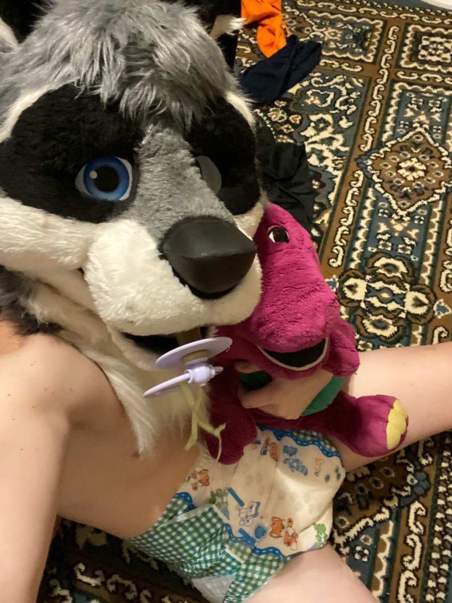 Look at <a href="/DiezelRaccoon/">Diezel🇺🇸</a> holding tight to Barney, even sucking his little pacifier. Just look at those diapers of his, you can tell he really likes to wear them often
