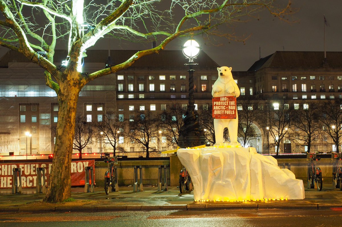 pacenvironment's tweet photo. A polar bear stands vigil in London, pleading the shipping delegates meeting across the street to protect its home. #IMOArcticSummit #ppr7 https://t.co/GXD9Ef4mqy
