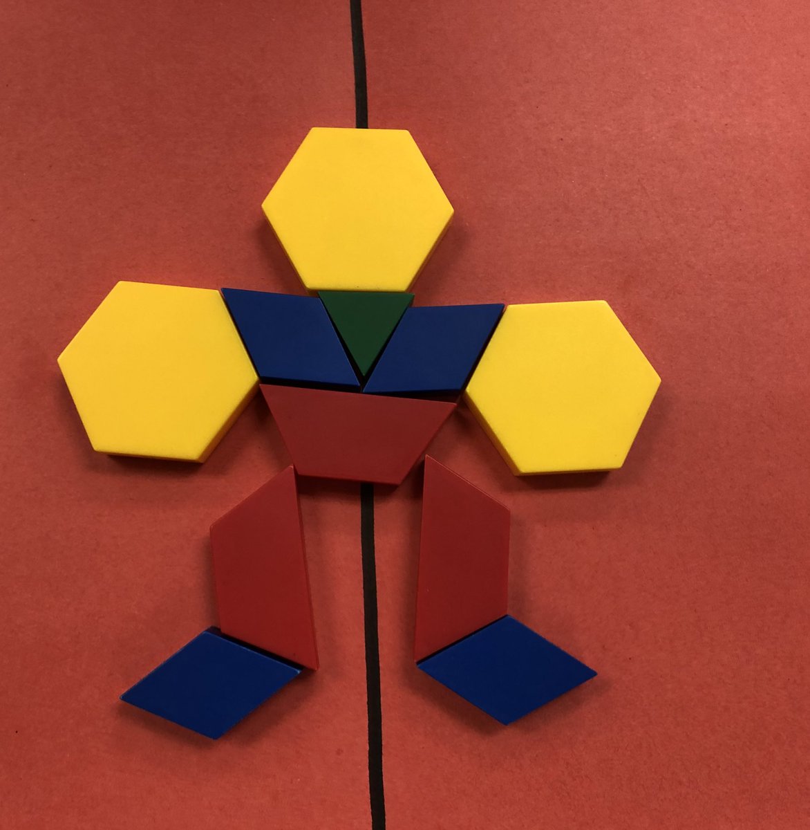 SLRMRSSB's tweet photo. Exploring symmetrical designs with pattern blocks and coloured cubes. Amazing math thinking happening! #mathmornings #geometryfdk https://t.co/twdxmkDXhX