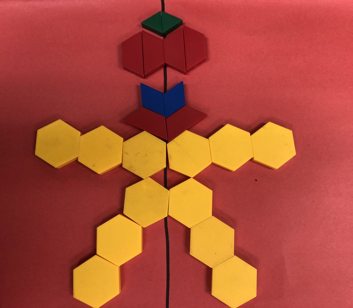 SLRMRSSB's tweet photo. Exploring symmetrical designs with pattern blocks and coloured cubes. Amazing math thinking happening! #mathmornings #geometryfdk https://t.co/twdxmkDXhX