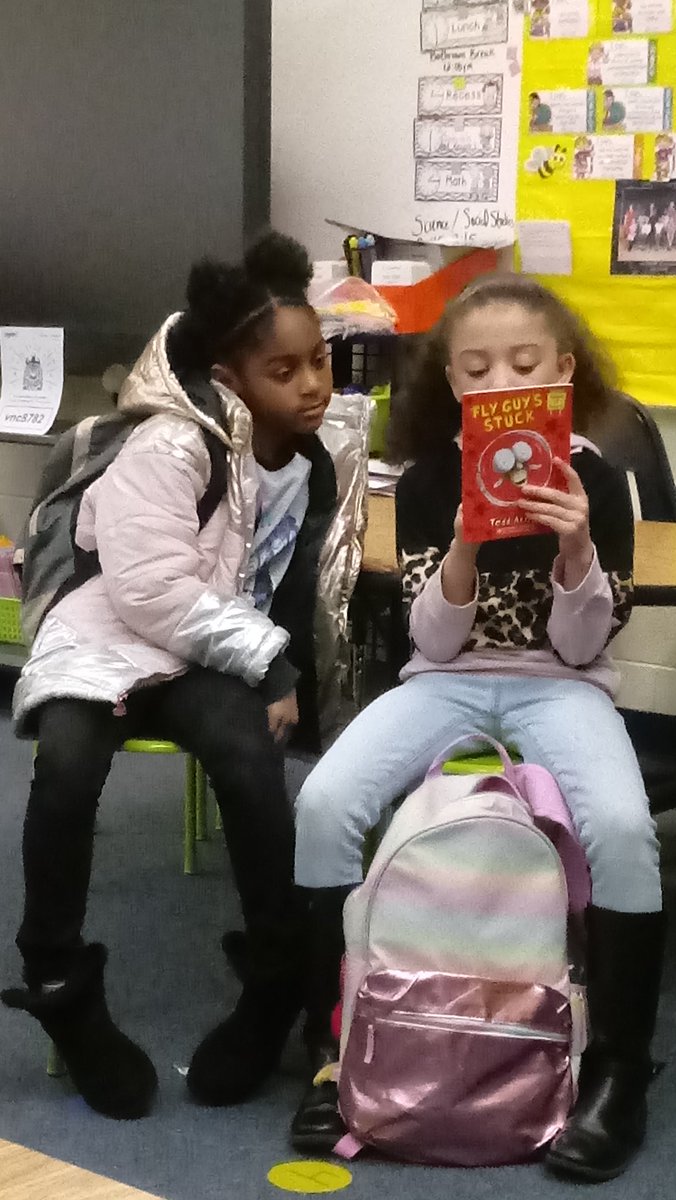 SchoolSouthside's tweet photo. Mariah and Kayla got caught reading a "Fly Guy" book while waiting for the bus. #SESBees #DeepRoots #GreatHeights https://t.co/XVa72qEVR9