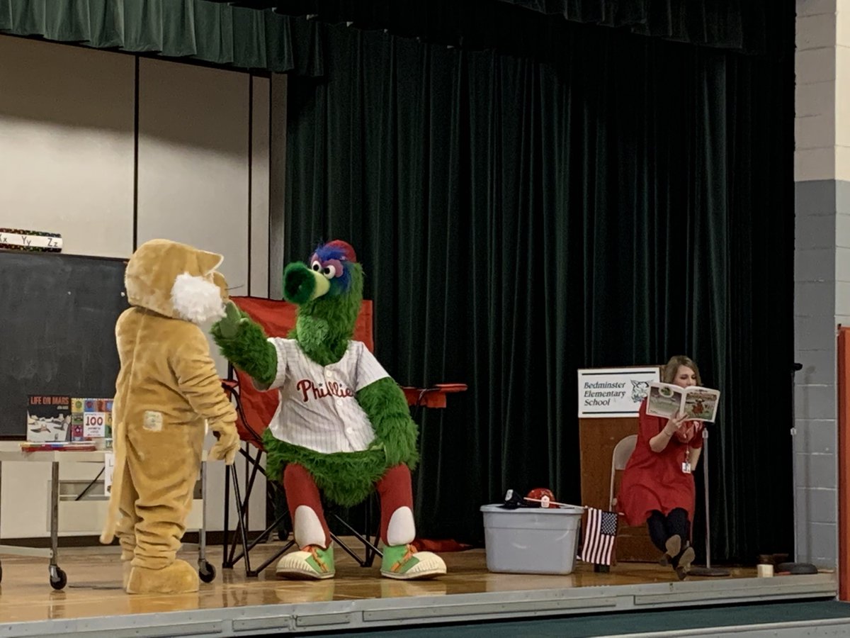 PSDTechVolak2's tweet photo. Even when the Phillie Phanatic visits school, we love to stop and read a great book!! #PhanaticAboutReading #PSDBedminster #PennridgeProud https://t.co/b0Fte92Ppz