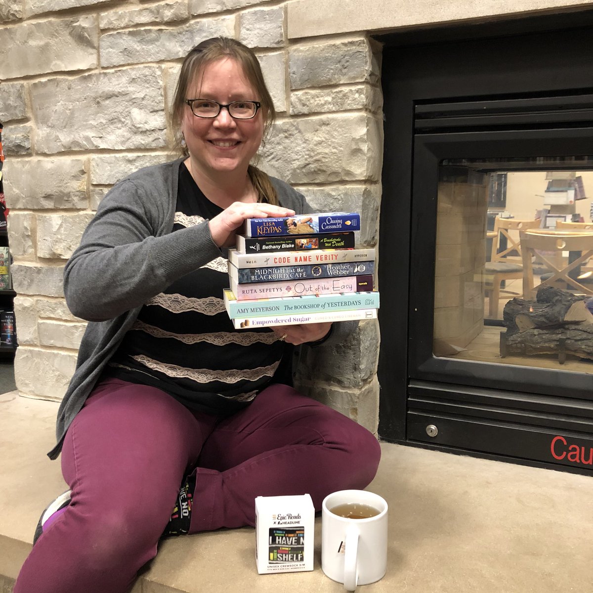 bnappleton's tweet photo. “Whatcha readin?” Heidi, being a die-hard #MoodReader, has all of her bases covered with her #CurrentlyReading stack - pairs perfectly with her #EpicReads #IHaveNoShelfControl socks & a cup of #HarneyAndSons #HotCinnamonSpice #Tea. #BNAppleton #BNMidwest #BooksellerRecommends https://t.co/i5QWdkGliY