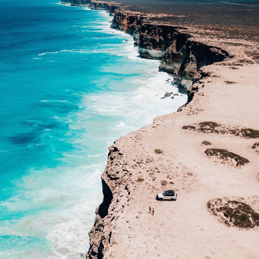 WestAustralia's tweet photo. BRB, we're crossing the #Nullabor 🚗💙 How stunning are these plunging coastal cliffs on the border of WA? You'll find this serene location near #Eucla in @Golden_Outback.

📷 IG/withsaltypassports #thisisWA https://t.co/mXu05RSRff