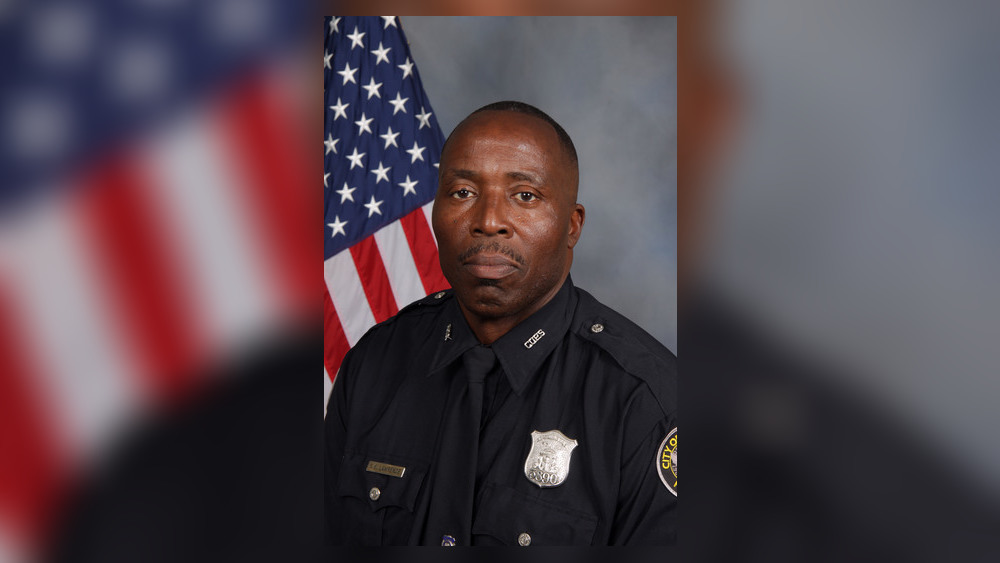 ajc's tweet photo. NEW: Photo released of Atlanta police officer, who was shot and killed in Riverdale this morning. His wife faces a murder charge https://t.co/ZPyCdcuyD5 https://t.co/y6FuEs4Lq4