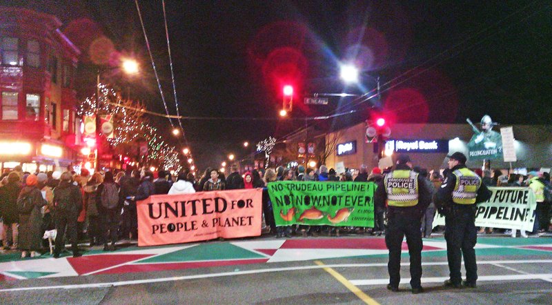 LesterMecca's tweet photo. Anti-pipeline marchers at corner of 1st and Commercial tonight in East Vancouver. Bold chanting supporting Wet’suwet’en hereditary chiefs.
#WetsuwetenSolidarity #pipelineprotest https://t.co/B57fwQy8MV