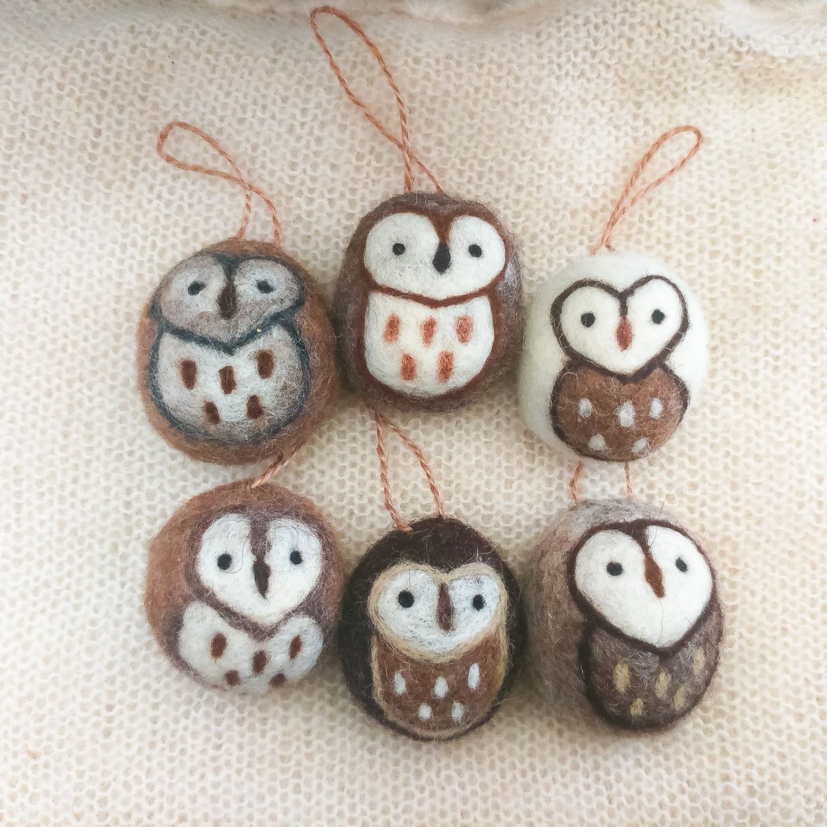 Little needle felt owl baubles. We're lucky enough to have some owls who twit twoo to each other in our garden. I love how these all have their own personality, despite being such simple designs. #DorsetTeam #owl #owlgift #needlefeltowl #feltowl #seasonaltree #treedecoration