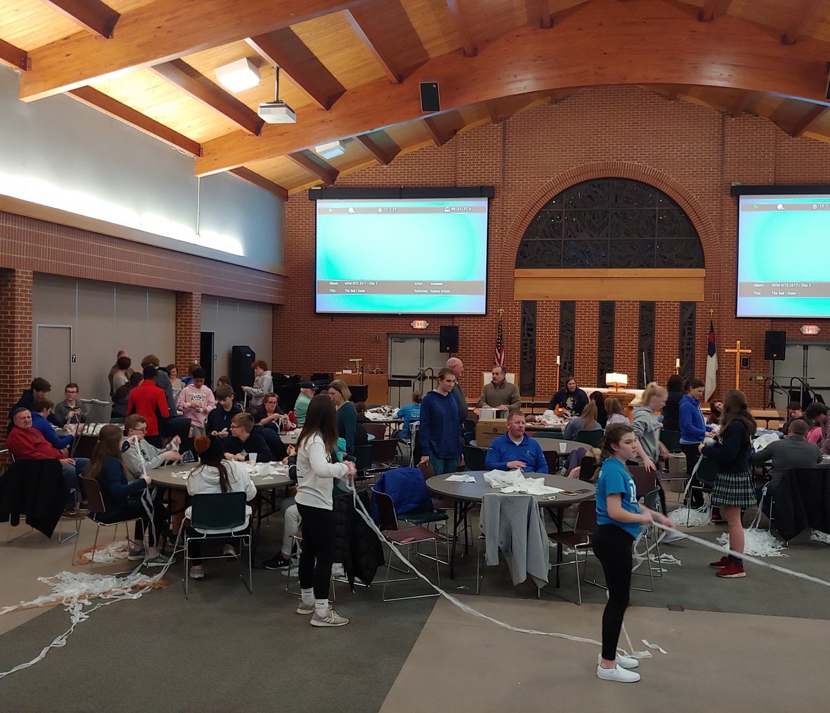 TrinitySoulard's tweet photo. Last night at Immanuel-St. Charles,  80  Middle School Confirmation students &amp; parents learned about homelessness &amp; did services projects for Trinity.  They made casseroles, brownies, sandwiches - scooped and measured laundry soap - and learned how to make homeless sleeping mats. https://t.co/zNtqGM0SCW