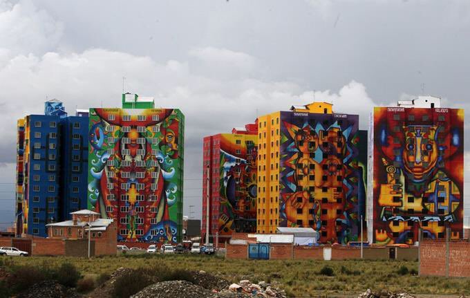 Seven blocks of social housing in El Alto, Bolivia, painted with murals by Roberto Mamani, 2015