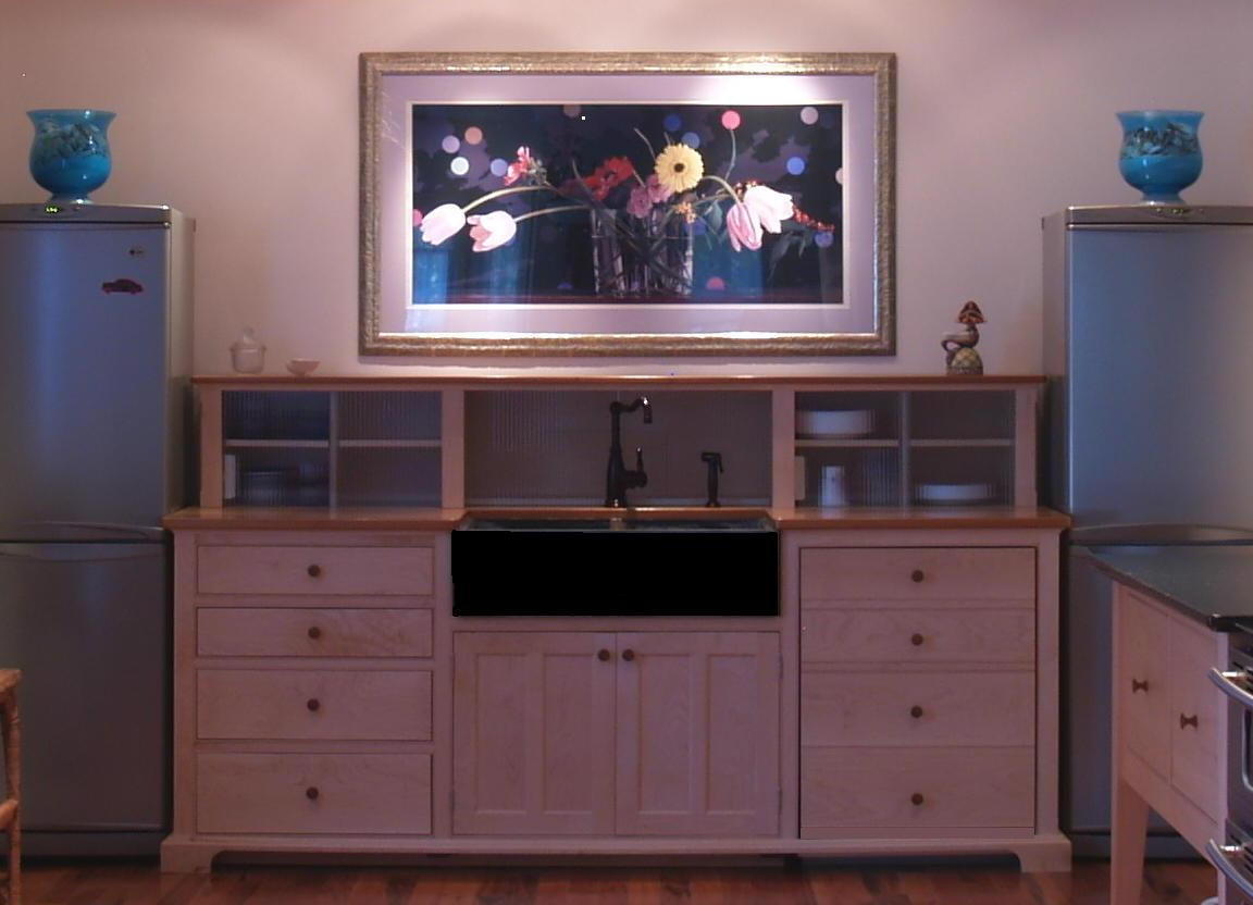 yestertec's tweet image. Exposed and matching refrigerator and freezer flank a sink workstation and a piece of artwork that becomes a focal point for the room. The symmetry is an artistic expression in itself. The storage piece above the 29" deep sink workstation hides a coffee maker and everyday dishes.