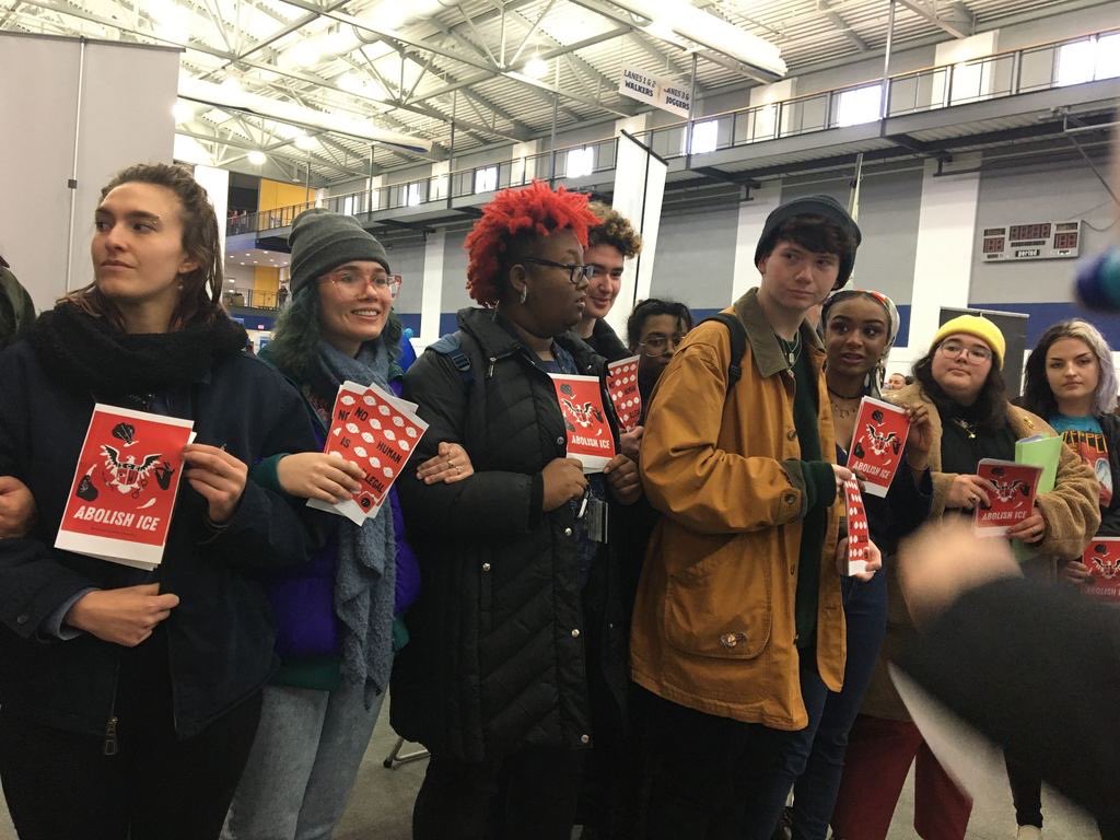 kentwired's tweet photo. BREAKING: Protesters are at the Beverly J. Warren Student Recreation and Wellness Center, where a job fair is currently taking place. The group of students are protesting against The Department of Homeland Security, which funds ICE, and is tabling at the fair. https://t.co/2e6GvMCeaB