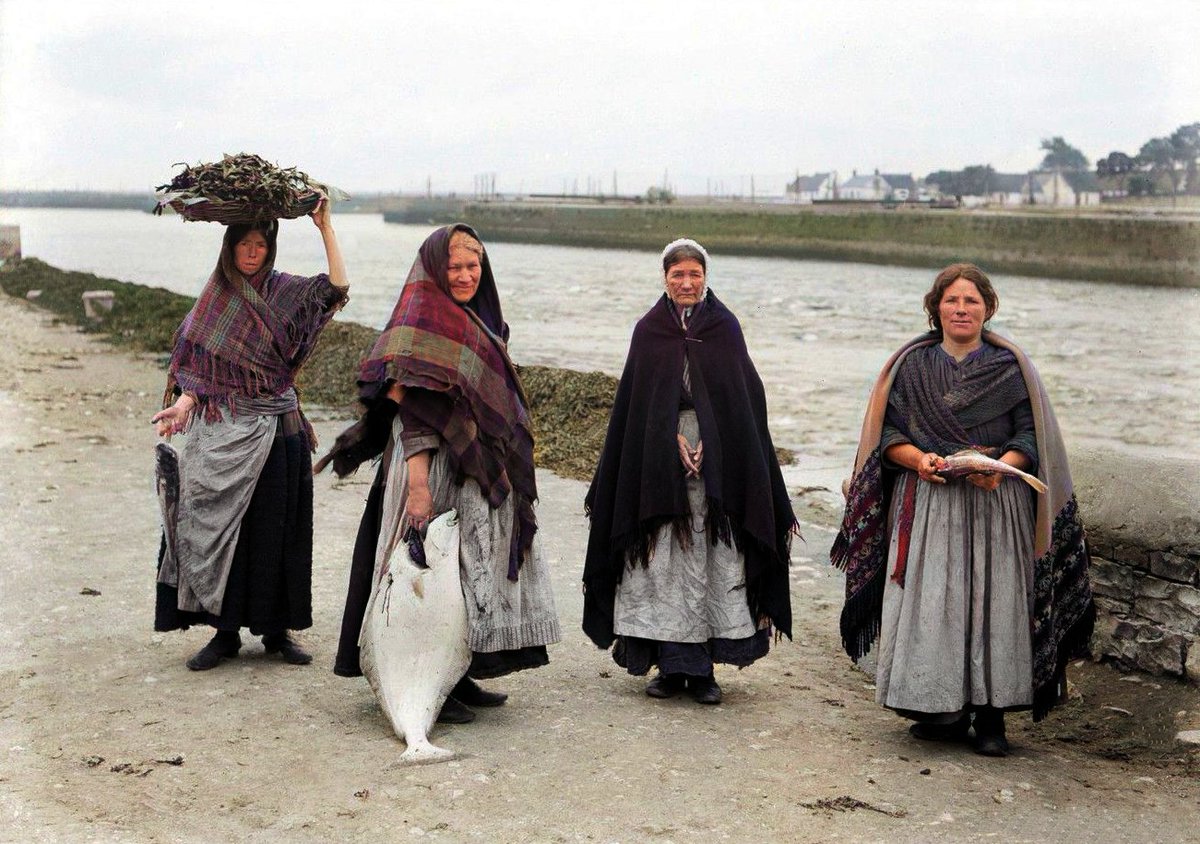 RobCross247's tweet photo. Bringing the lost history of Galway to life!🐟
My restored &amp; colourised 1905 photo featuring four women selling fish on Spanish Parade on the Spanish Arch side of the Claddagh in Galway City with Claddagh Quay and Nimmo's Pier in the background.
#Galway #Dublin #Ireland #DeOldify https://t.co/Ub5P9q8WOm