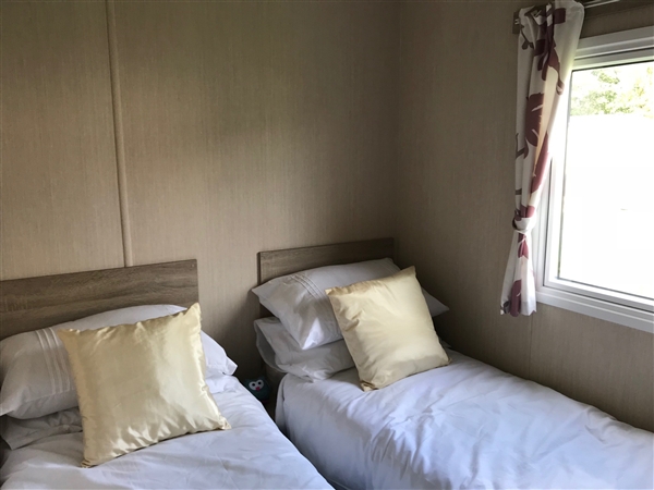 This stunning open-plan caravan is available to purchase for £22,000 (plus connection fees). With 2 bedrooms and beautiful surroundings, this caravan would make an ideal family holiday home. 

If you would like to find out more, call us on 015395 58266 or email opw@holker.co.uk.