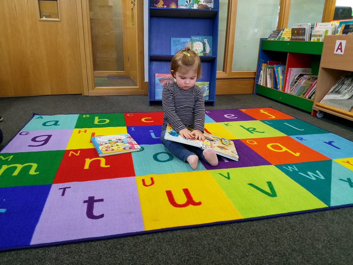 RoehamptonL's tweet photo. The new story-time rug in the children's is already working its magic! ✨Here is Henny enjoying a good book!📖 A book worm in the making 😍📖 #lovebooks #fridayfeeling #love2read https://t.co/blOPLApJNz