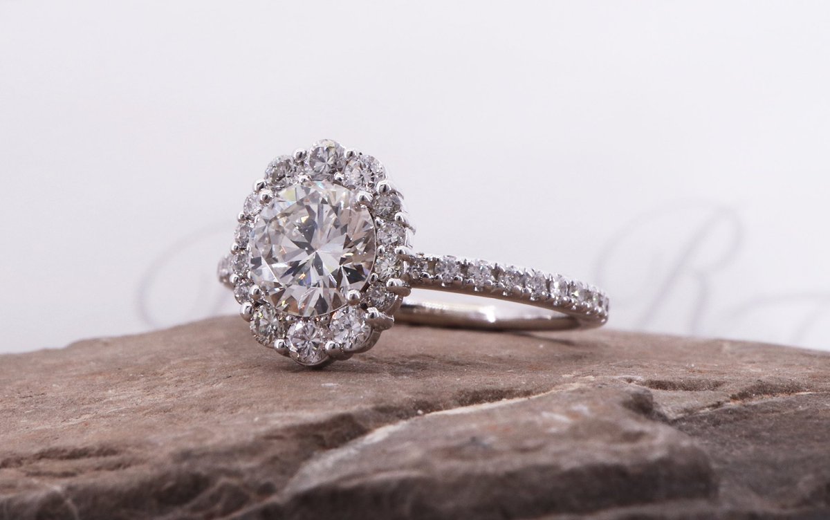 Custom made engagement ring designed with a round brilliant center and oval halo. Simply gorgeous! #wemakeitjustforyou #rickterryjewelry #wewanttobeyourjeweler