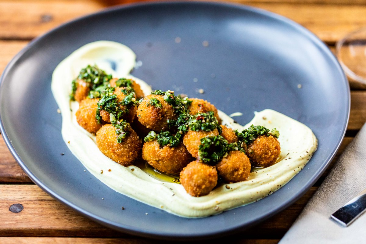 WaltonsAustin's tweet photo. These Coated Olives with curry yogurt + chimichurri are a ⭐ on our  Bon Apéro Happy Hour menu! Join us for delicious $5 snacks + $6 sips Thursday-Saturday from 5:30-7:30pm https://t.co/w7Gav7ZtFY