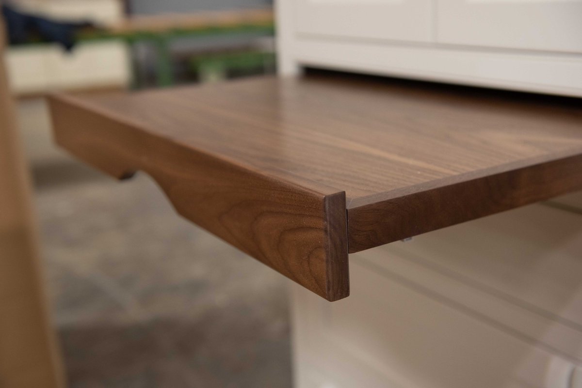 Plain_Fancy's tweet photo. This white tall cabinet features a unique, exposed Walnut pullout drawer that is both functional and decorative. Tweet us & let us know wht you would use this custom pullout drawer for in ur kitchen. #kitchencabinets #walnutcabinets #pulloutdrawer #customcabinets #kitchendesign https://t.co/EMn3El8OR2