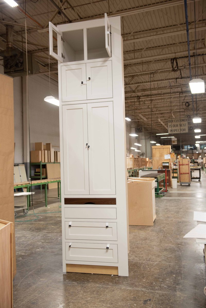 Plain_Fancy's tweet photo. This white tall cabinet features a unique, exposed Walnut pullout drawer that is both functional and decorative. Tweet us & let us know wht you would use this custom pullout drawer for in ur kitchen. #kitchencabinets #walnutcabinets #pulloutdrawer #customcabinets #kitchendesign https://t.co/EMn3El8OR2