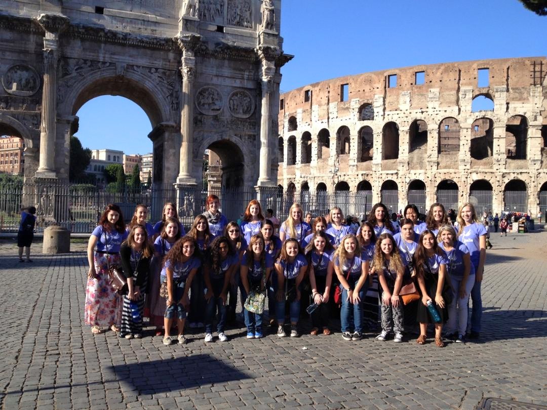PGCsings's tweet photo. #FlashBackFriday to our Cantabile tour in Italy in front of the Coliseum, summer of 2014! Our tours this year will take our Dolce choir to California, our Bella choir to Oregon, and our Cantabile choir to the Baltic States! We love touring with our PGC singers! https://t.co/3SA1yIZBeS