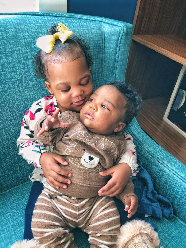 StJude's tweet photo. Last year, we shared a photo of patient Sparrow with her baby doll. This year, she’s traded her toy in for cuddles with her new baby brother! Sparrow is still in treatment for infant acute lymphoblastic leukemia but is doing great. https://t.co/NnD6XKx1Ai