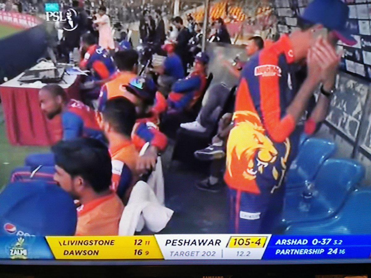 PeterDellaPenna's tweet photo. Since when are mobile phones and mobile phone conversations allowed in a team dugout during a live T20 (or any) match? https://t.co/O93wtx2SwE