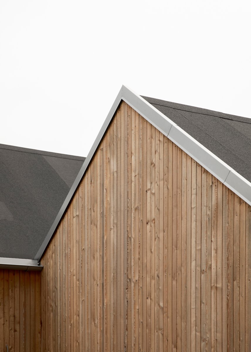 Harmoniously set into the cliff and breathtaking nature of the rocky, unspoiled coast of Sweden, this recently completed summerhouse makes for a modern escape, embracing all aspects of family life.