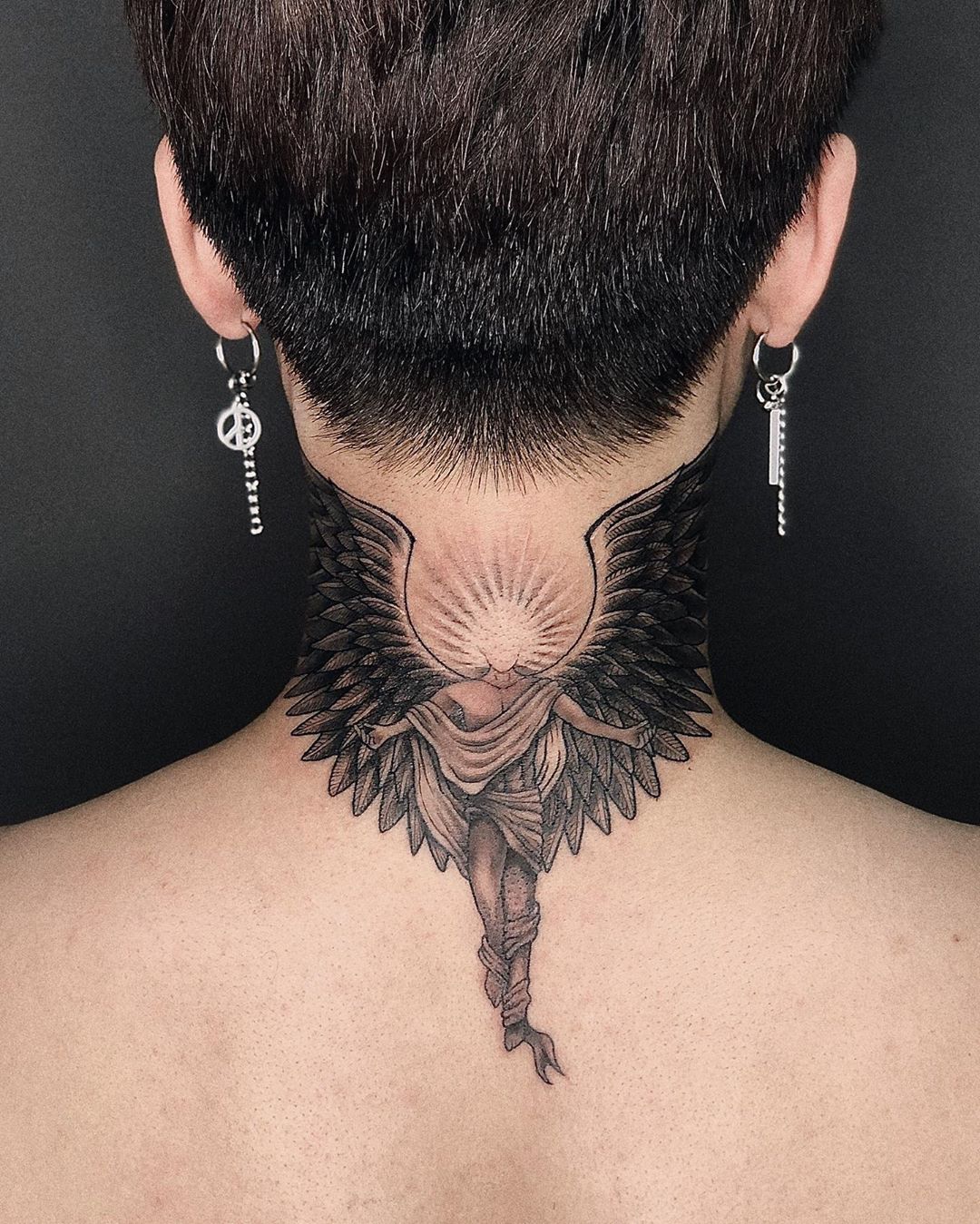 Simple dragon tattoo behind the ear by Brenda Kaye TattooNOW