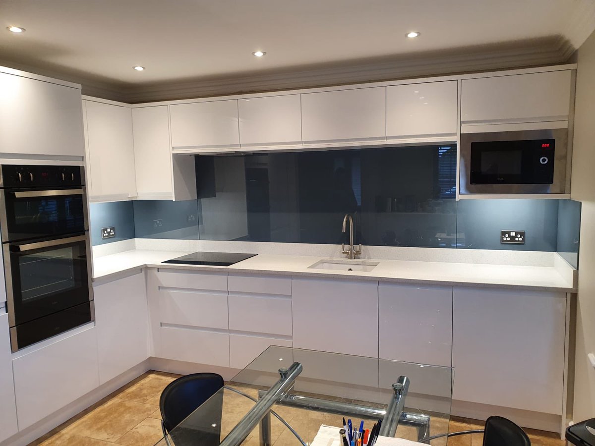<a href="/NottsKitchens/">InspirationalKitchen</a> dramatic blue glass splashbacks in this #whiteglosskitchen