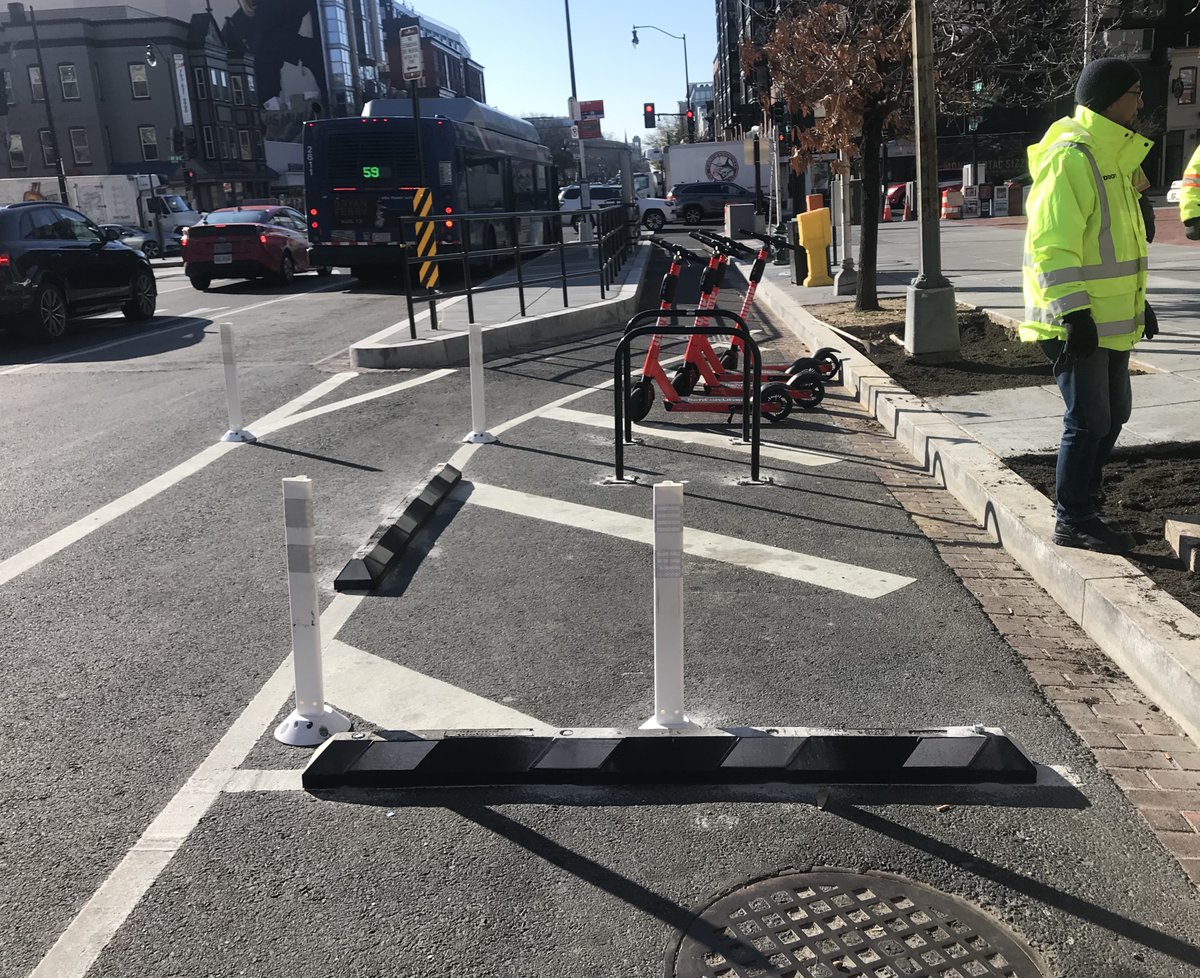 Productive morning out on 14th St NW w/ the project team talking safety. We're adding improvements to the streetscape design, like this bike/scooter parking corral, to ensure all roadway users are safe. More safety improvements coming soon: bit.ly/2uWGVZj
#VisionZeroDC