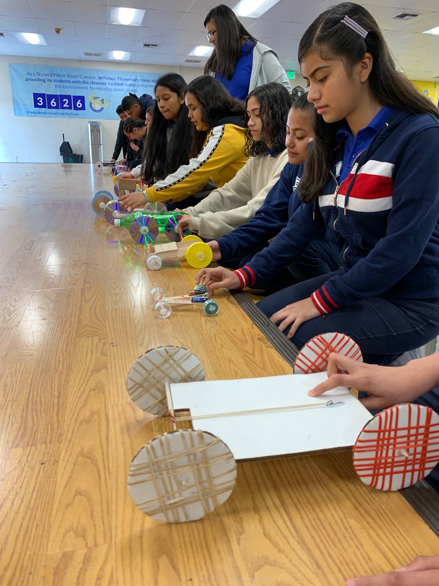 MrsMcCarter3's tweet photo. Jefferson’s 8th Graders are testing out their rubber band-powered vehicles for the Knott’s Physics Day Competition.  @PrincipalAquino @jbibbsfox https://t.co/TRUxkIteme