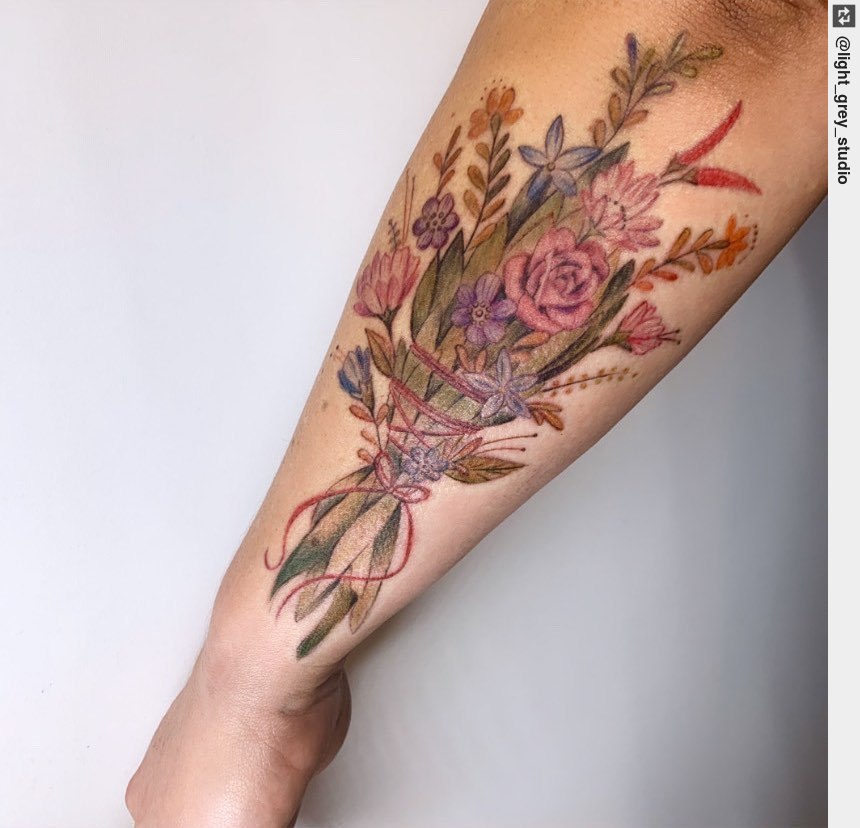 Flower tattoo on the inner forearm