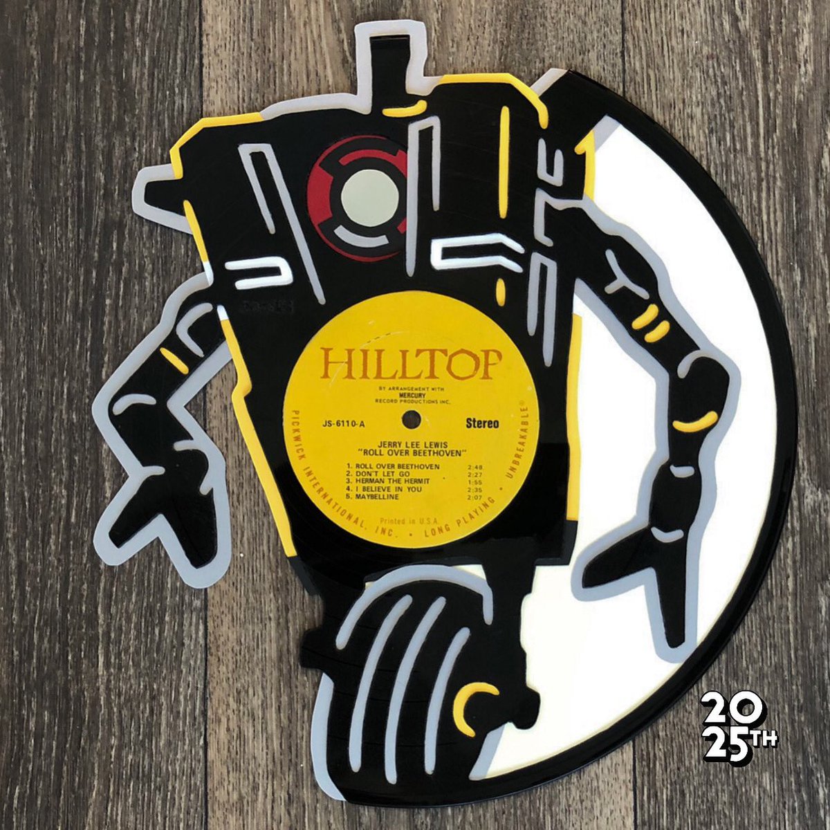 2025thStreet's tweet photo. One of my favorite game series of all time is getting a movie, and I couldn’t be more excited! I have wanted to make something for a while, so this was a great opportunity to make a vinyl of this sassy little robot. Claptrap, my spirit animal, cut into damaged vinyl. https://t.co/4PTgfqq66d