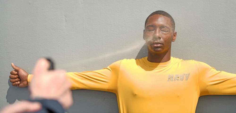 USPACOM's tweet photo. Sailors from @UsPacificFleet @NavysFlagship USS Blue Ridge #LCC19 are sprayed with oleoresin capsicum spray during Security Reaction Force Basic #SRFB training. #ForgedByTheSea #OCOCOC #FreeandOpenIndoPacific https://t.co/mz7hJVRuWR