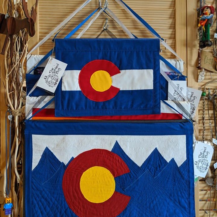 FunFunkyGallery's tweet photo. Hand-sewn Colorado Flag window and wall hangers, quality creations from Colorado seamstresses and crafters ONLY at the FUN & FUNKY Bailey, Colorado! #FunFunkyGallery #Colorado #craftspeople #artistsoftwitter #artists https://t.co/LjoFdhBgmt