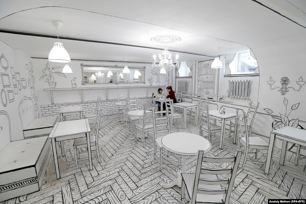 BCAmagazine's tweet photo. People visit newly opened B&amp;W cafe in center of St. Petersburg, Russia. The interior of first black-and-white coffee shop to open in Russia looks drawn. This effect was achieved by creators using white paint and black lines. All repairs and design were done by hand in 35 days. https://t.co/x58BXk2k29