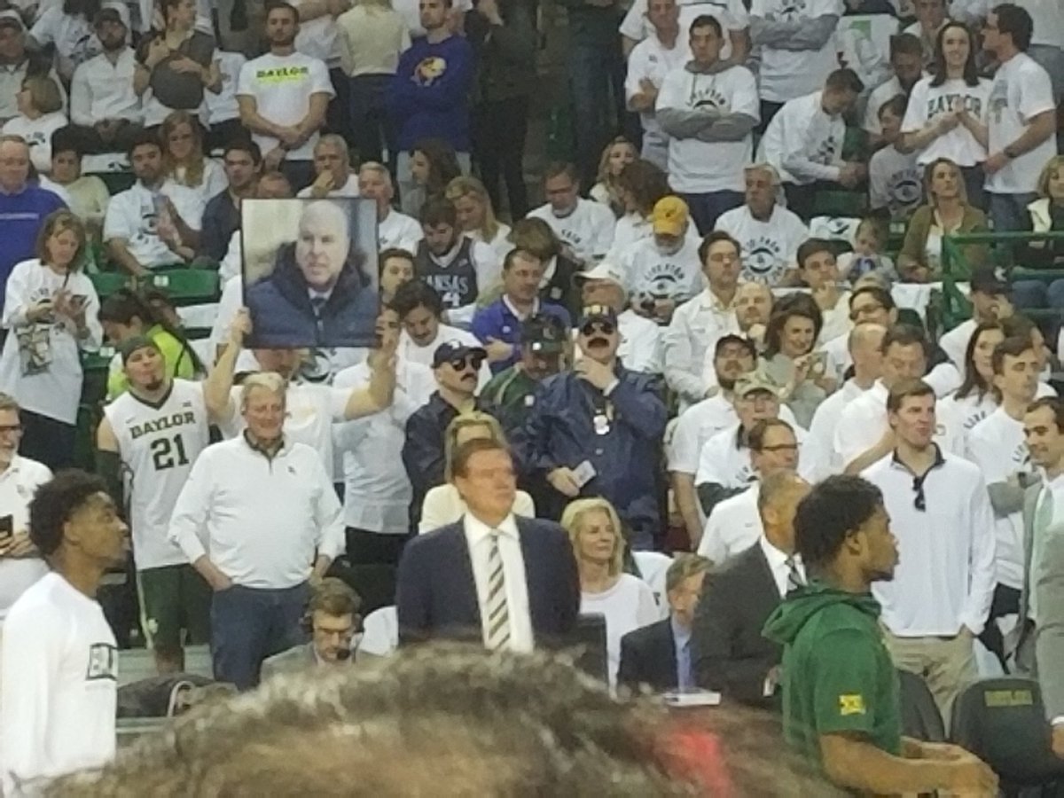 mattmosley's tweet image. Couple of FBI agents behind Bill Self.