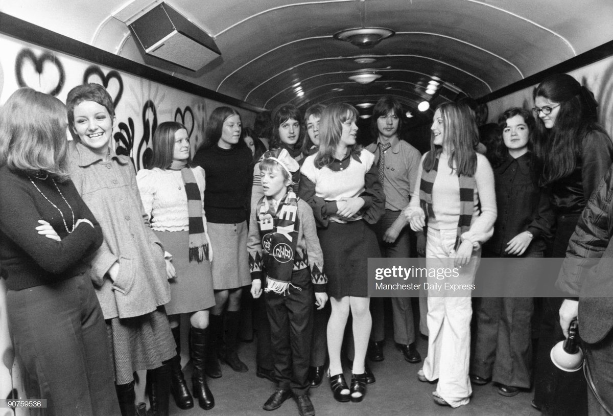 A young Burnley fan in a train carriage converted into a disco, January 1973. Photo by SSPL