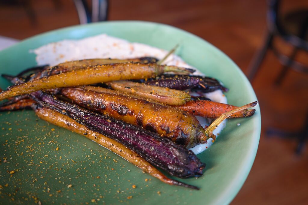 Add some color to your table on this dreary day in the form of embered carrots; served with tahini yogurt and spiced with vadouvan.