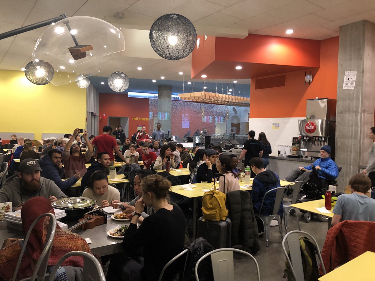 ATHackMIT's tweet photo. It's dinner time! Lots of demos and prototypes later, we're getting to hear from all the different teams. https://t.co/DBsaEJ2e4g