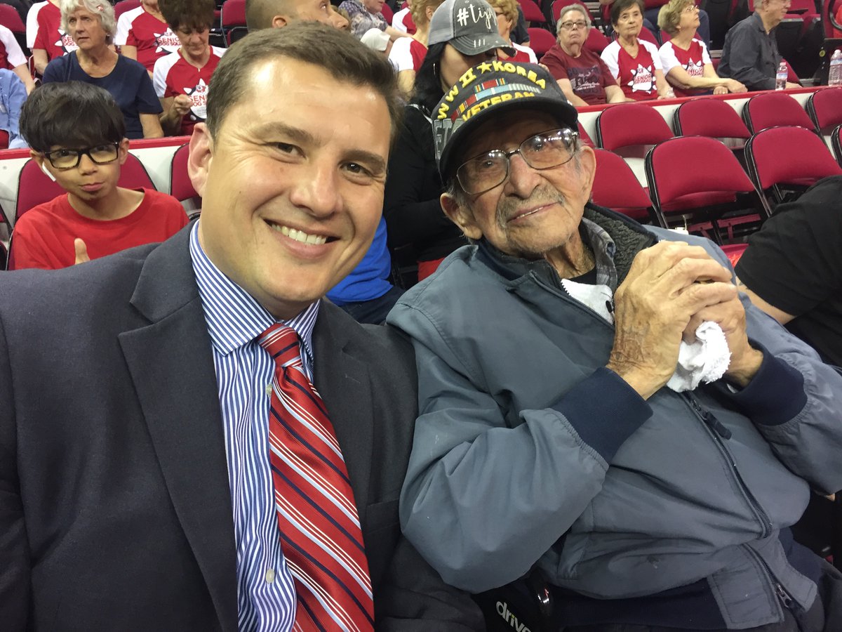 P356Loeffler's tweet photo. So great to see my old friend Frank Paredes! 100-yr-old Pearl Harbor survivor will be honored in 2nd half @savemartcenter. @FresnoStateMBB trails Wyoming 22-21 at half. Catch the rest on @940ESPN. #LookingGoodFrank #FreedomIsNotFree https://t.co/XMBD64FRgo
