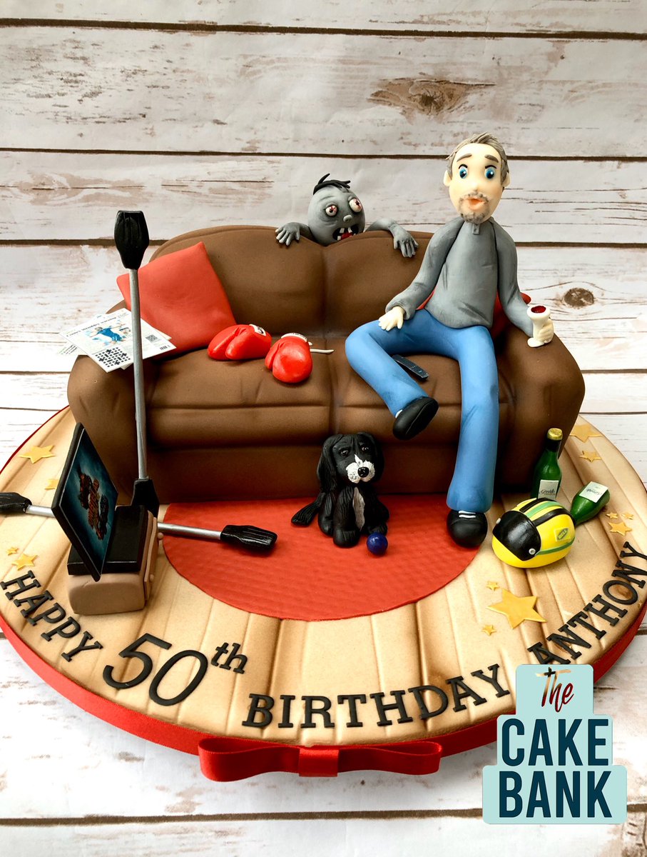 The_cakebank's tweet photo. A carved 50th birthday cake with the birthday boy & his favourite things #zombie #zombie cake #sofacake #lowton @RenshawBaking @sugarcraftmag https://t.co/U7NtxvjfeI